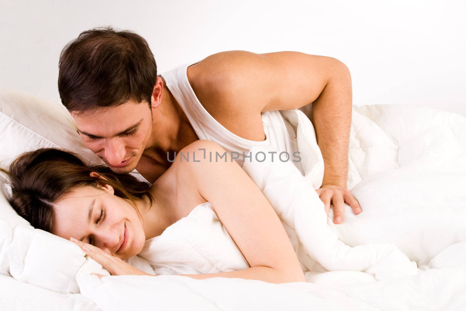 Young adult couple in the studio waking up