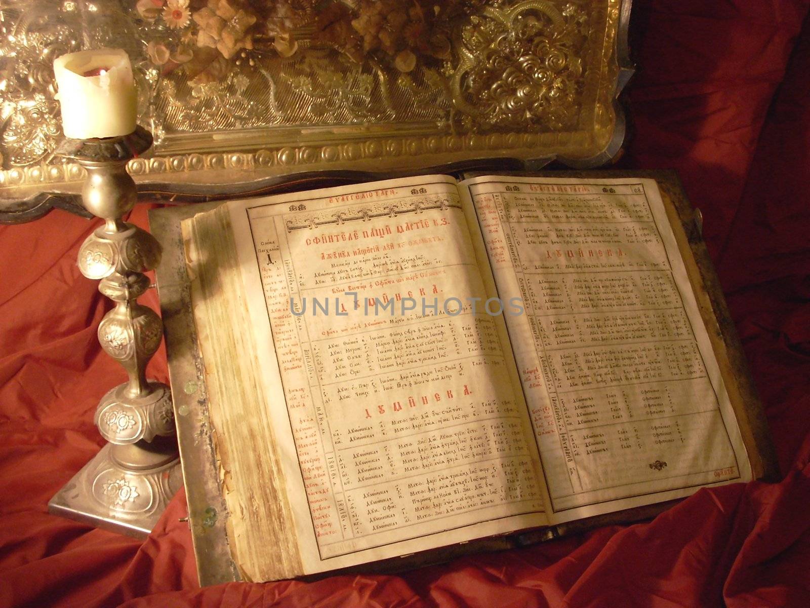 Religion still life with antique Bible, candlestick and candle by DOODNICK