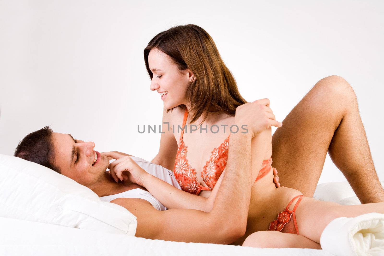 Young adult couple in the studio smiling