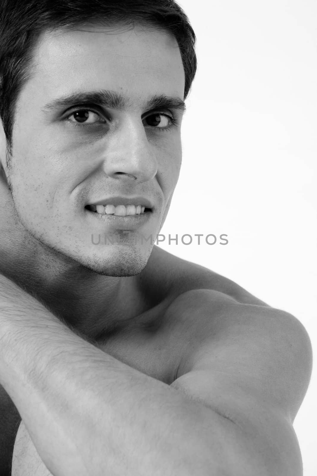 Young man portrait in the studio on a white background
