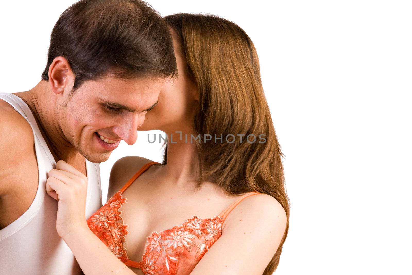 Young adult couple in the studio hugging