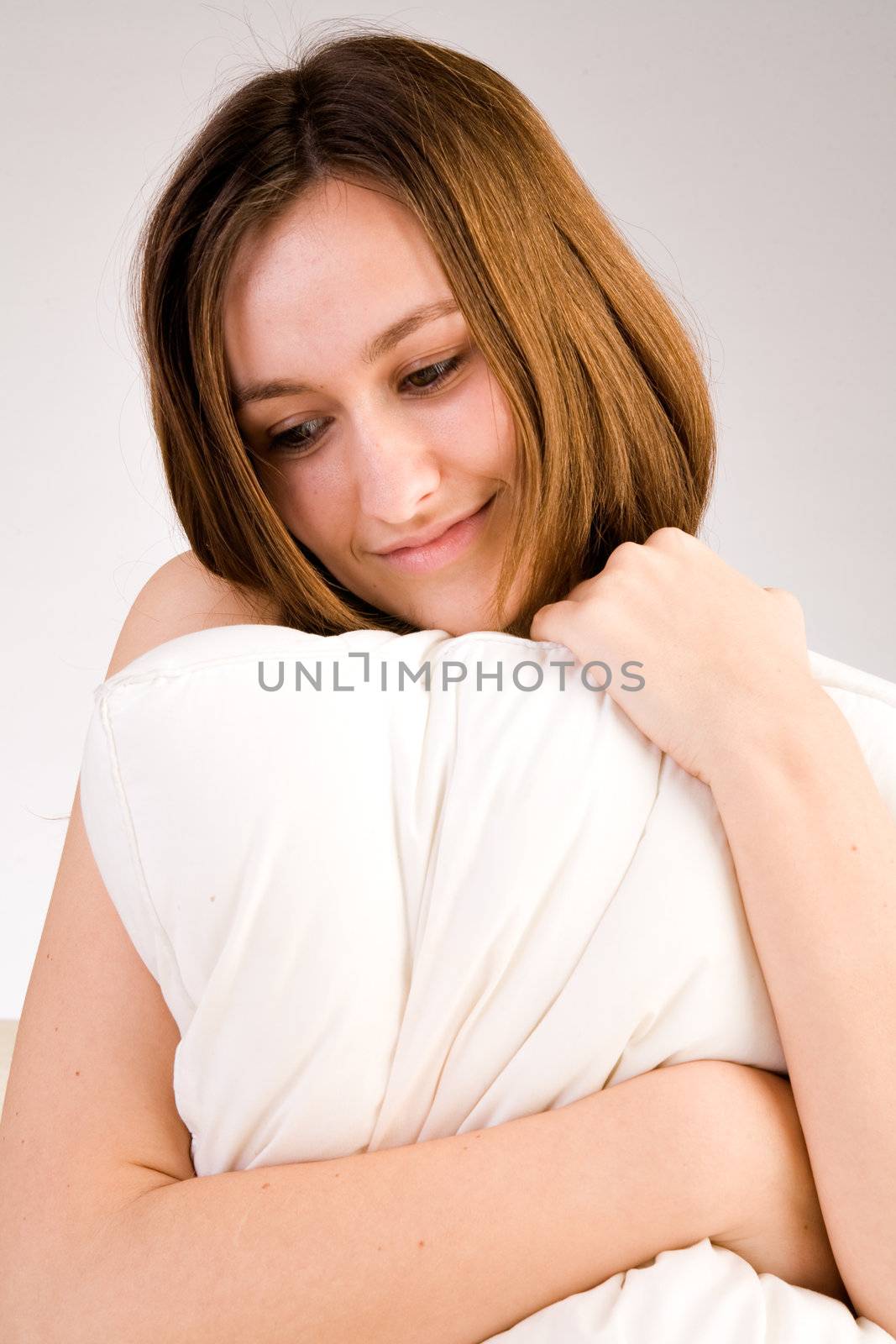Young woman portrait in the studio on a white background