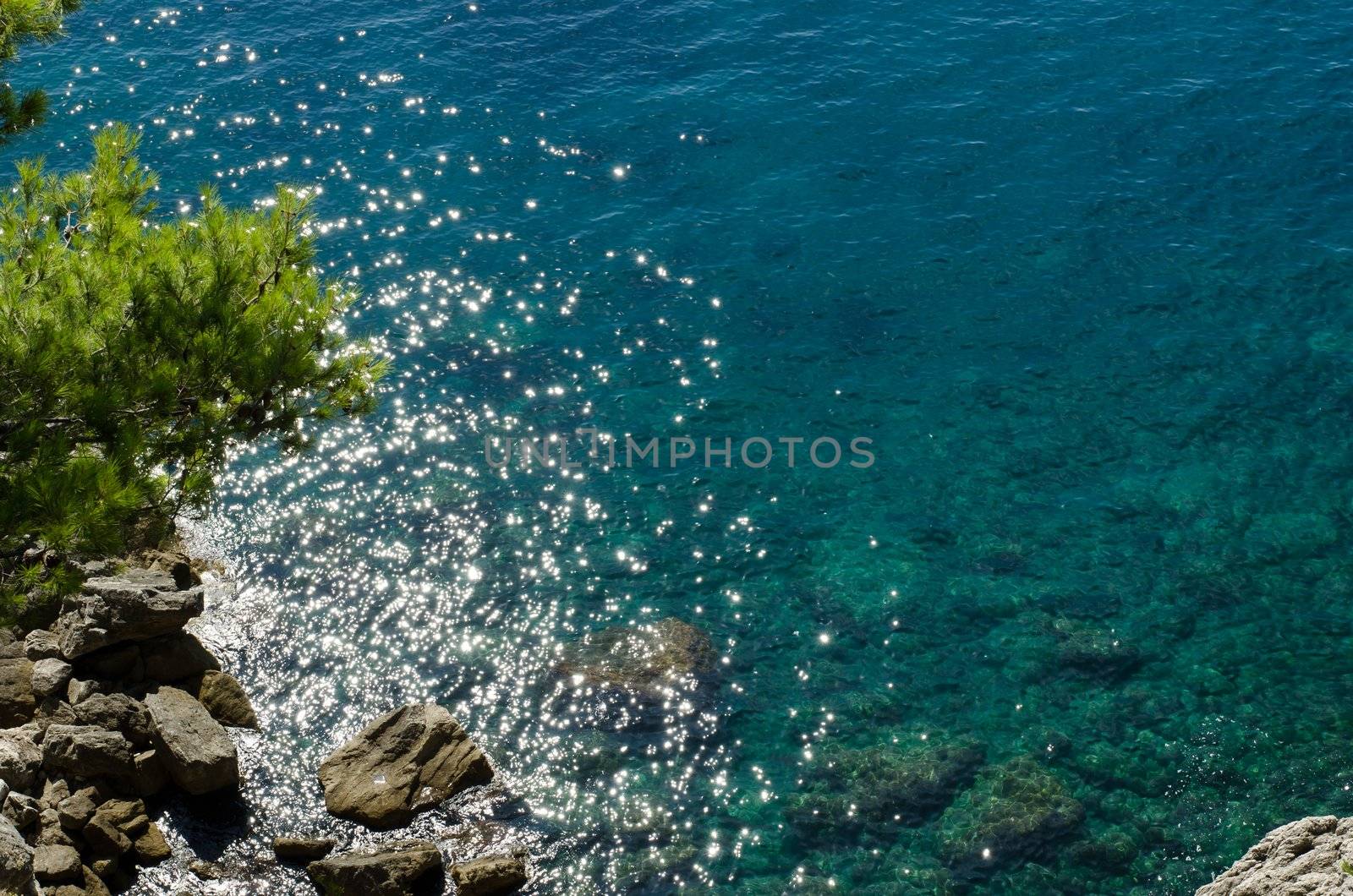 View of the Adriatic sea from above with sunshine stars in the water