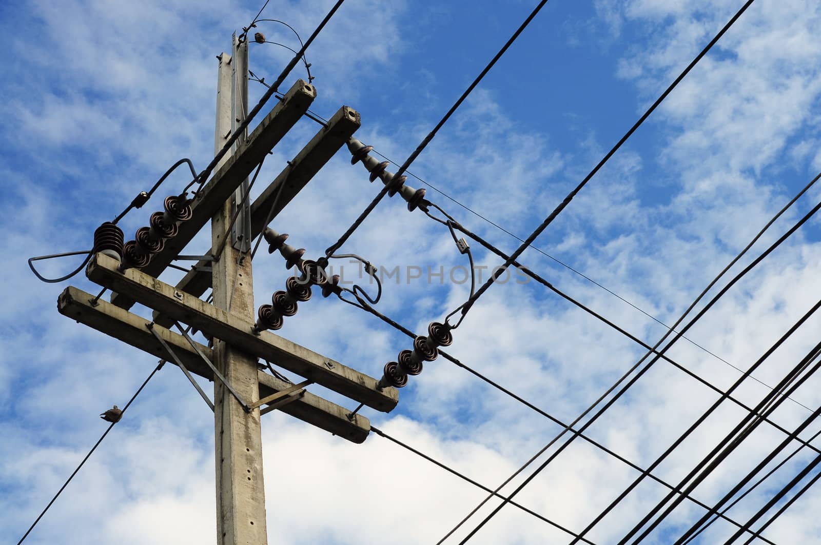 electricity post in blue sky