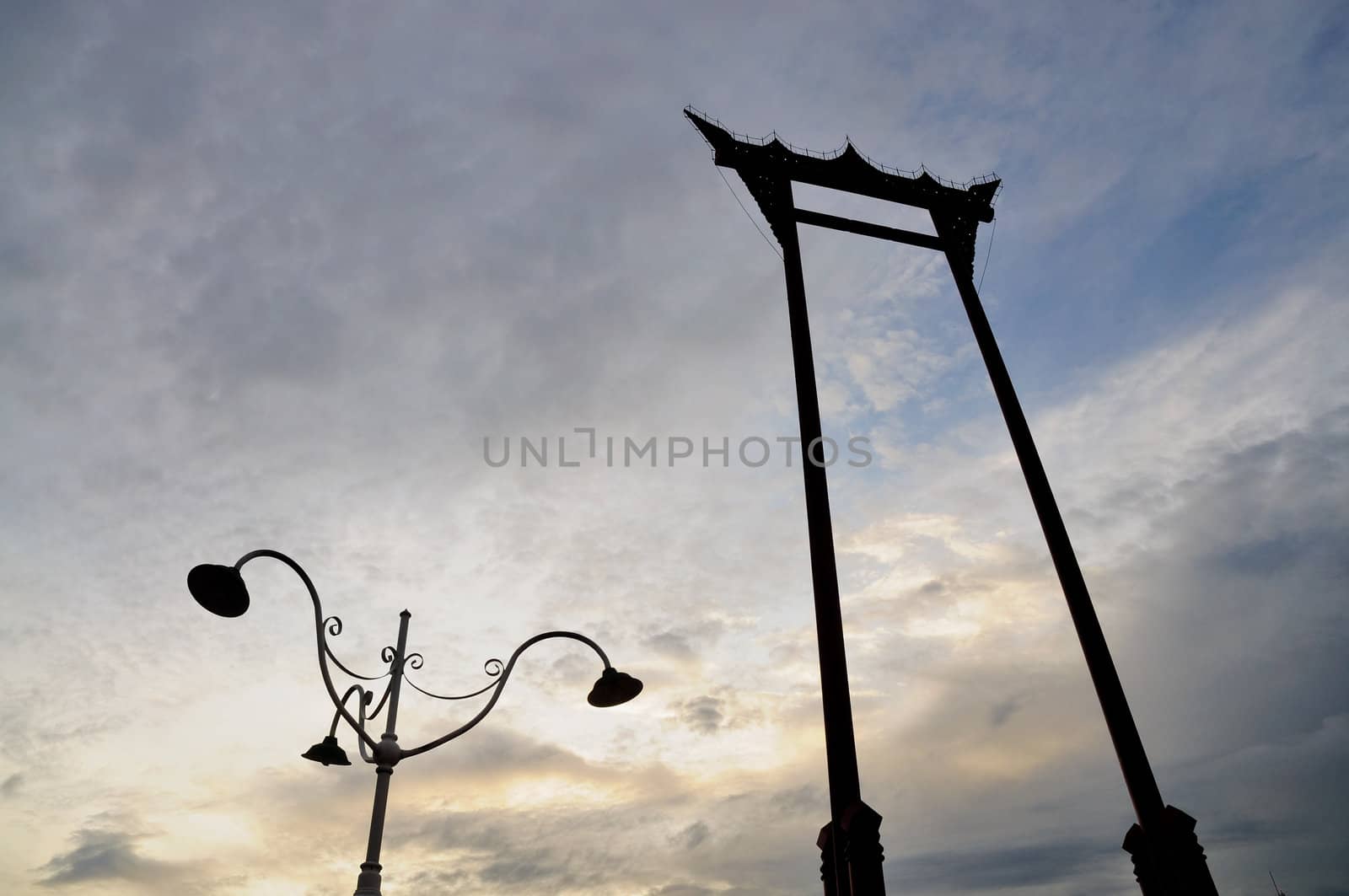 great swing in blue sky before sun set