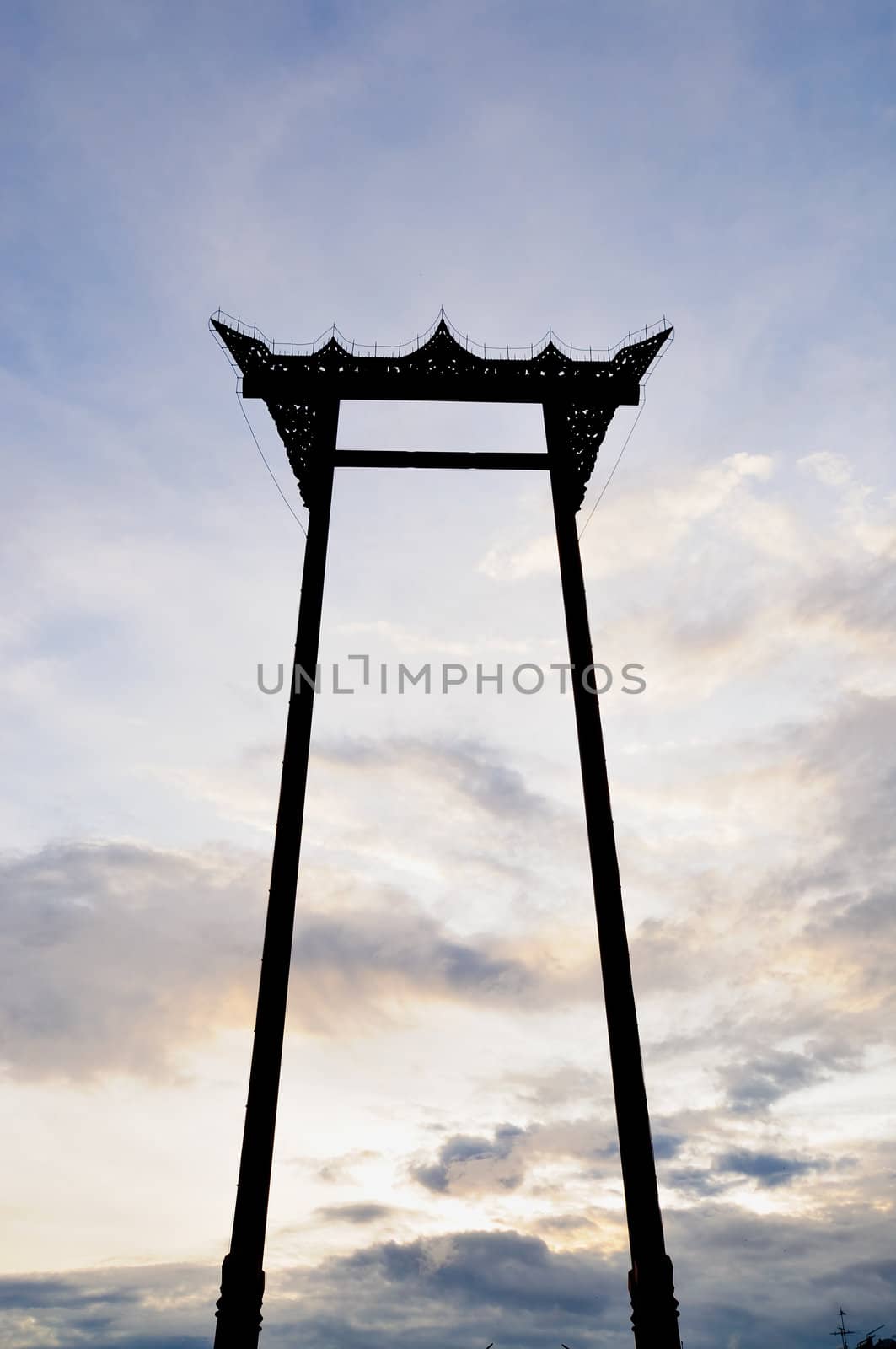 great swing in blue sky before sun set