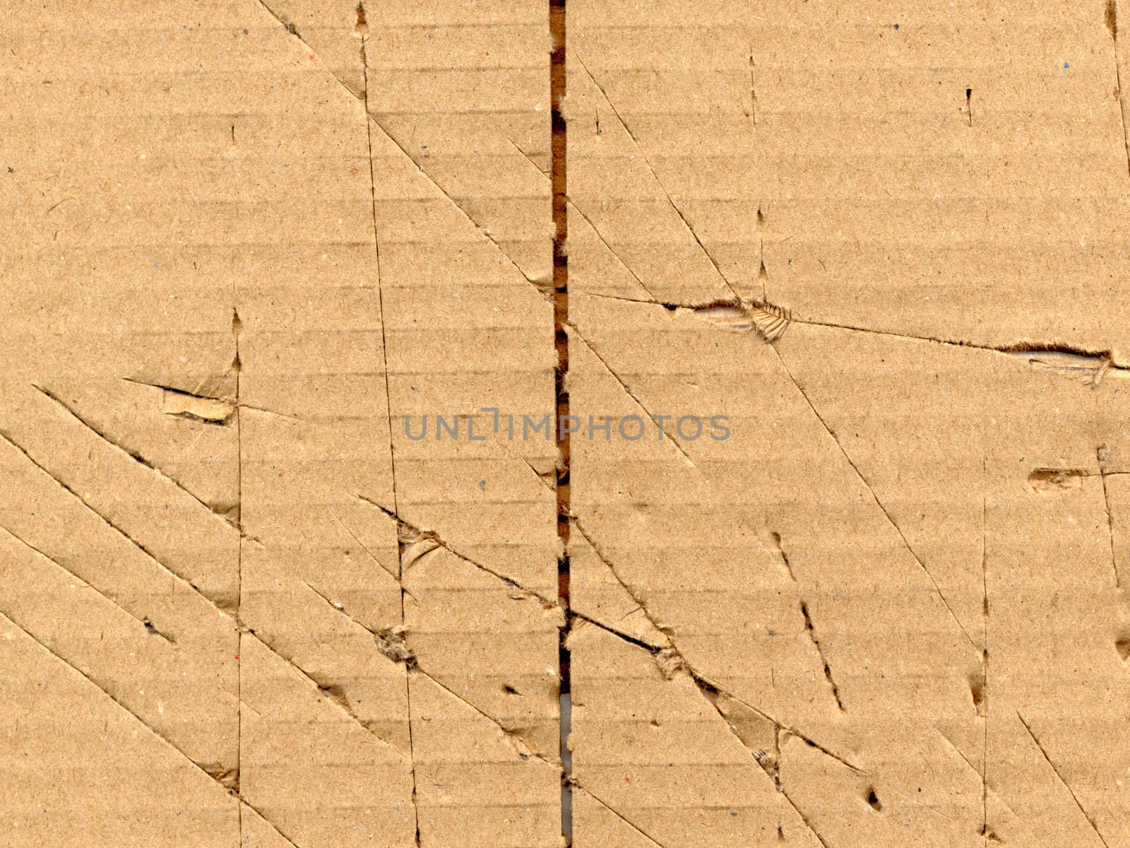 Brown grunge corrugated cardboard sheet useful as a background
