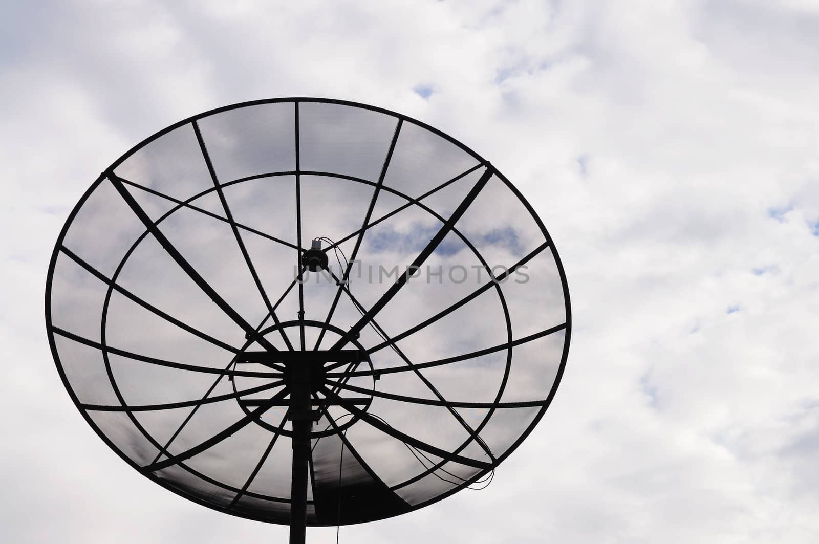 Sattelite dish in the cloudy sky