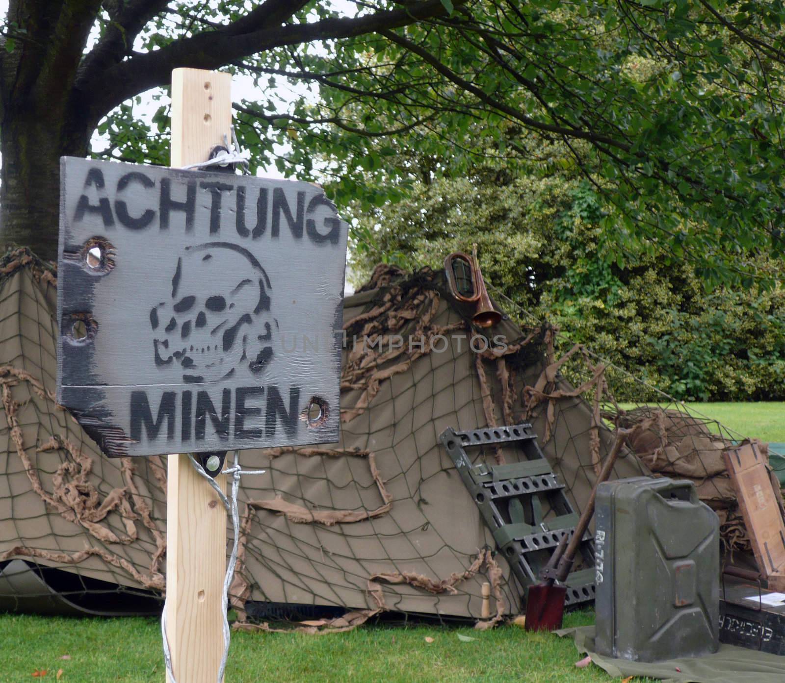 Warning german mine field with world war two tent
