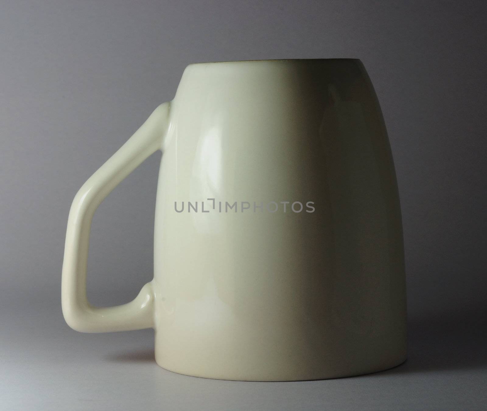 white ceramic cup by ekawatchaow