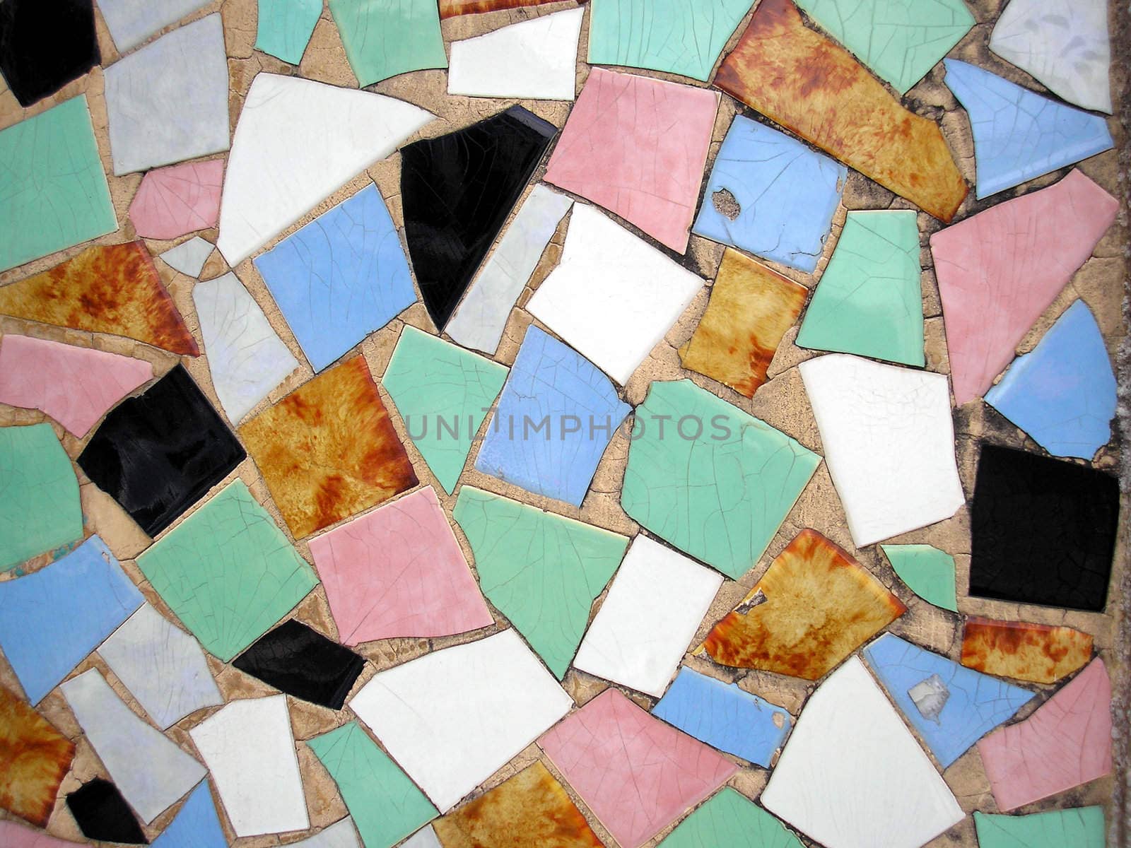 Multi coloured tiles forming an opus incertum pavement useful as a background
