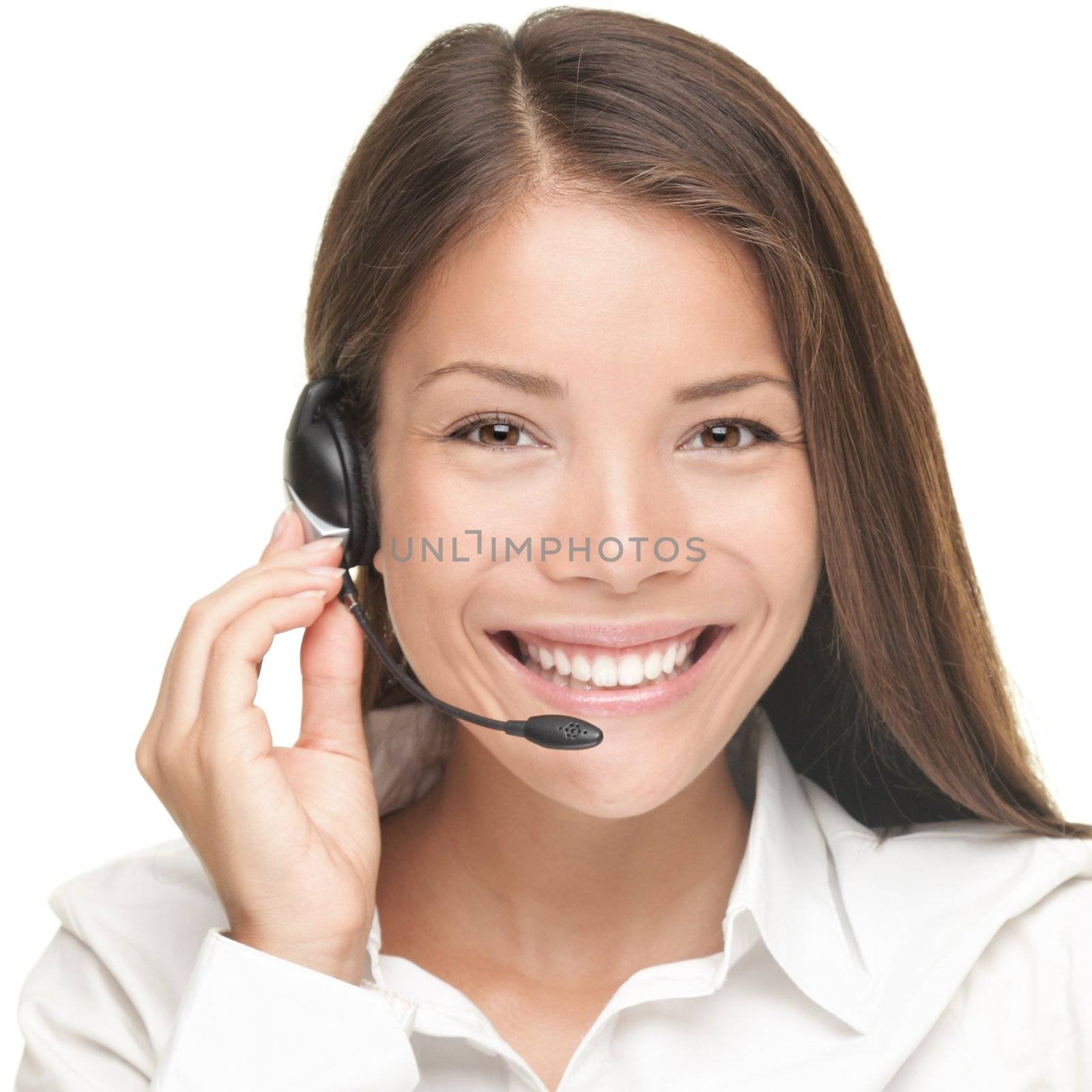 Customer Service woman smiling talking on headset. Close up portrait of beautiful young Caucasian / Asian. 