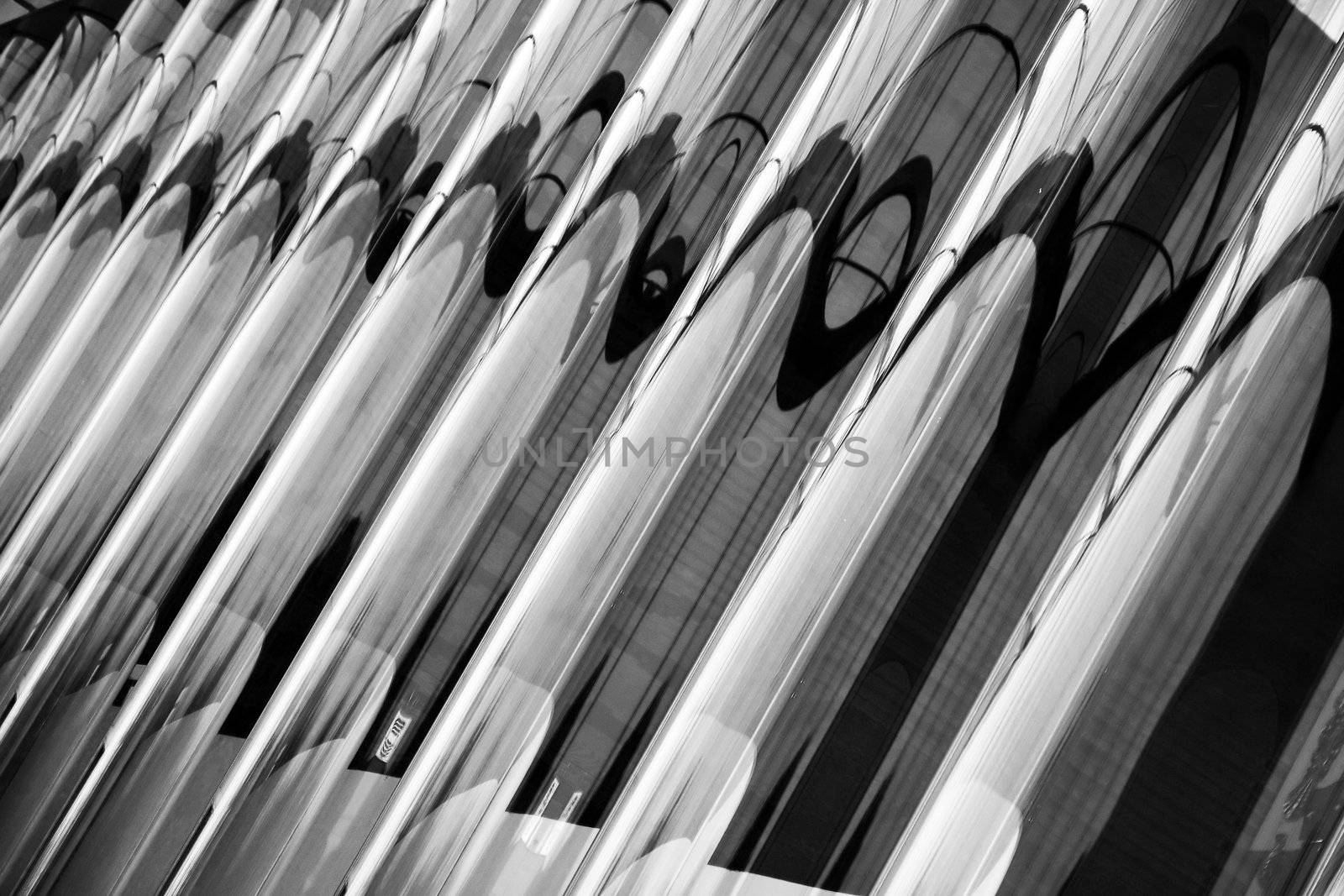 Abstract view of a glass waved wall in black and white.