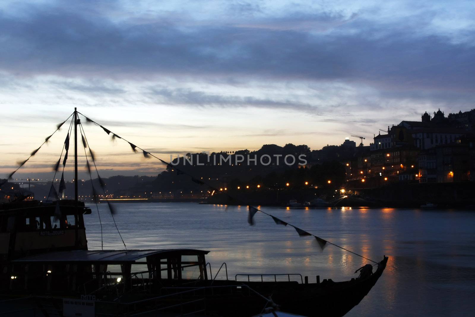 Night view of the old historical area of Porto city on Portugal by the river.