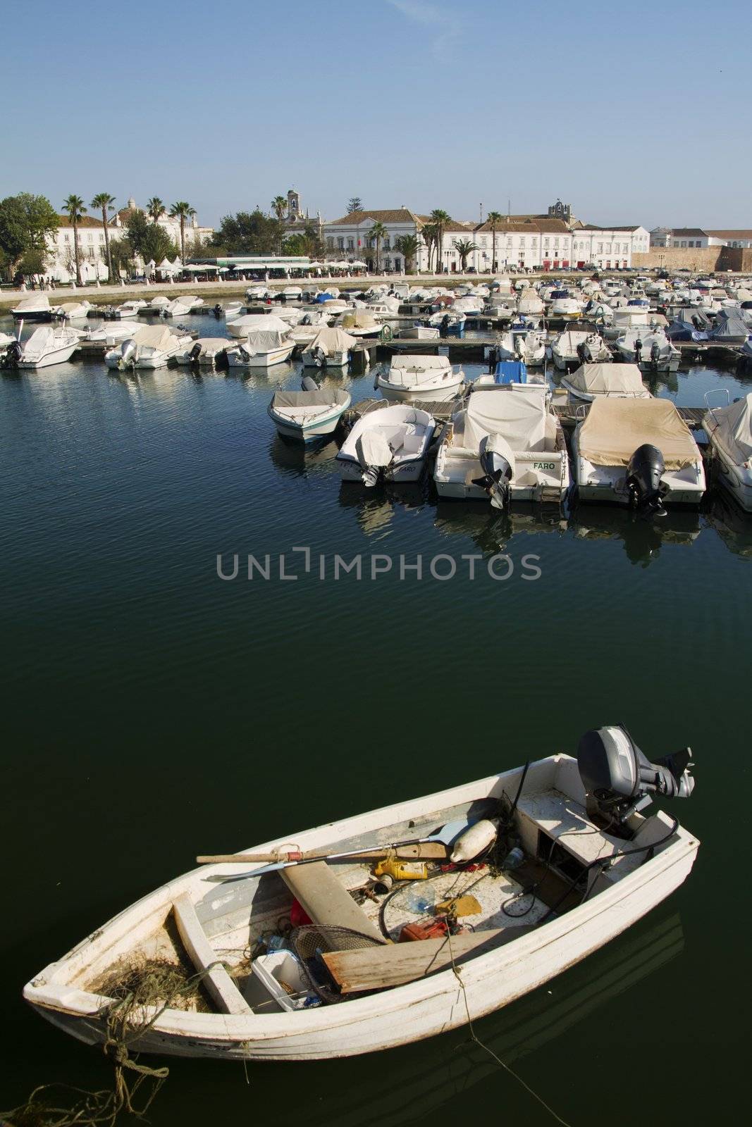 View of the marina with traditional fishing boats on Faro,  Portugal.