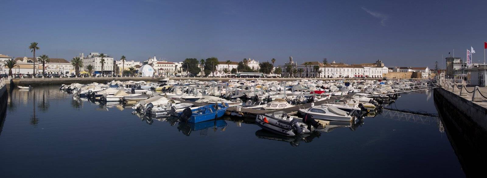 View of the marina with traditional fishing boats on Faro,  Portugal.