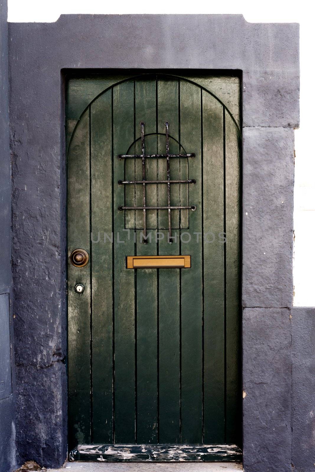 Close view of an ancient medieval green door.