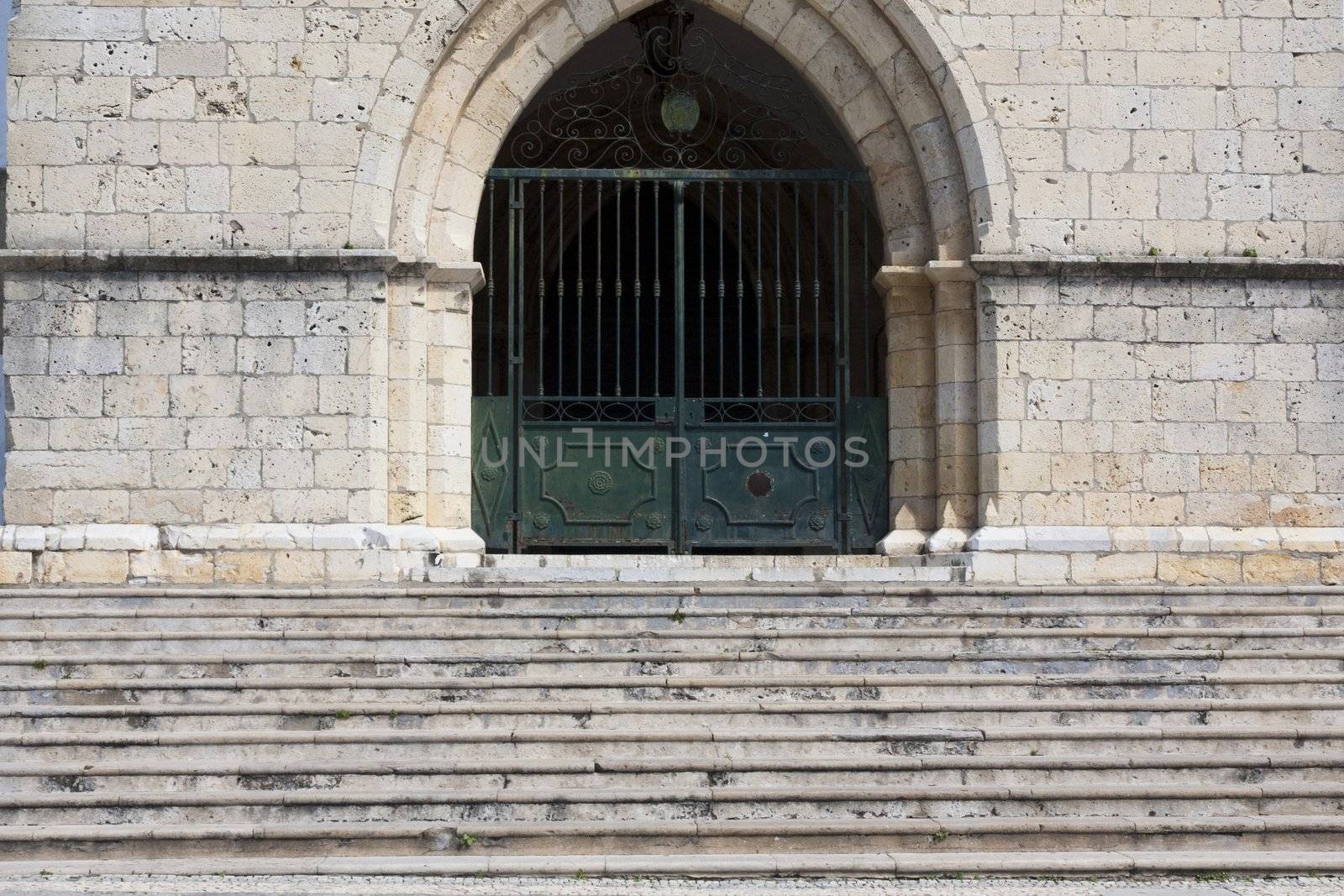 View of an old entrance to a church with stairs.