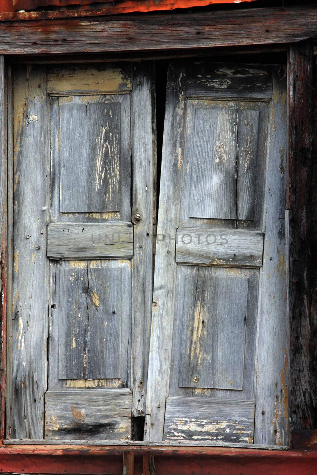 Close view detail of an old wooden broken window.