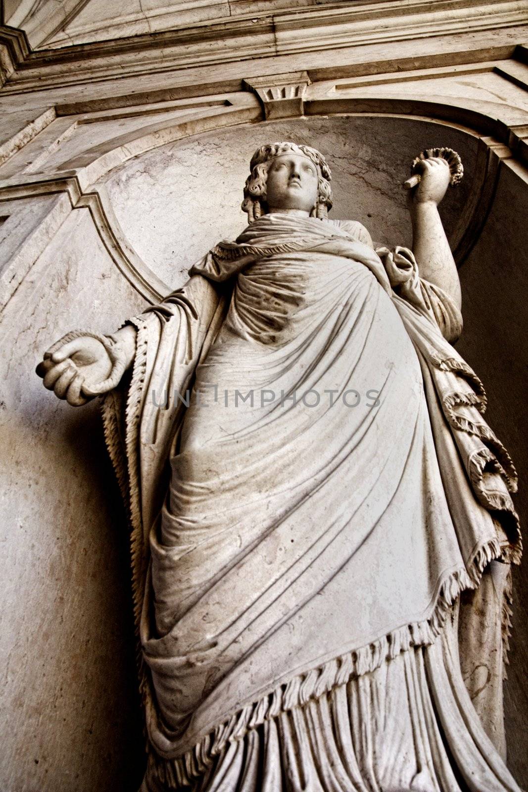 Close view of a statue of a women located on the entrance of the National Palace of Ajuda in Lisbon, Portugal.