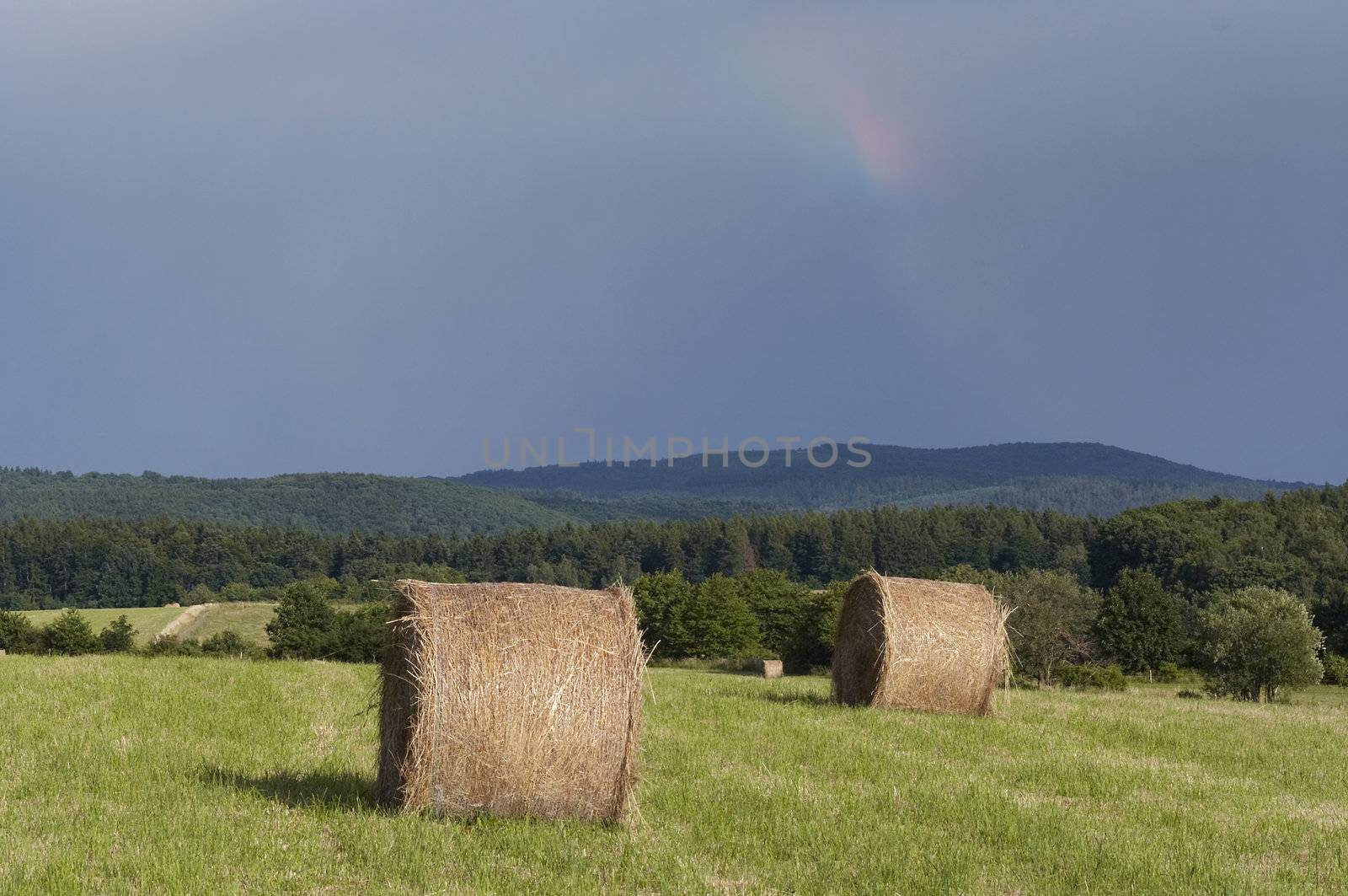 Shot of the dark sky with rainbow