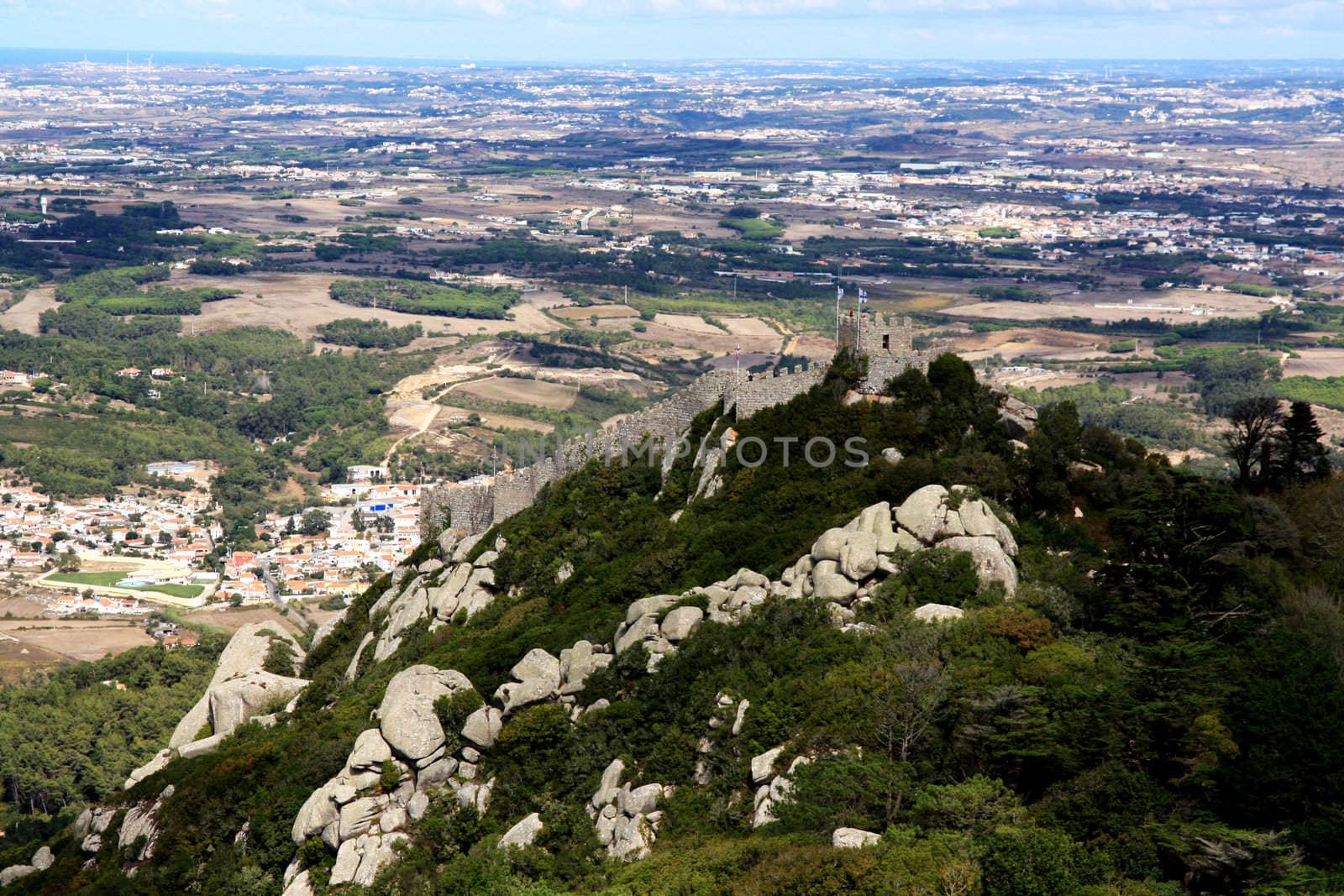 View of the landmark "Castelo dos Mouros" located on top of the Sintra National Park in Lisbon, Portugal.