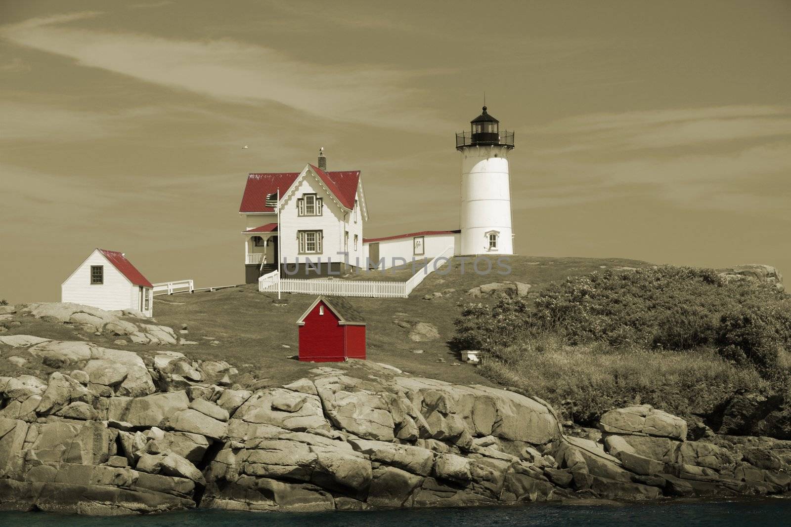 The Cape Neddick Nubble light house in Sepia and selective colors.