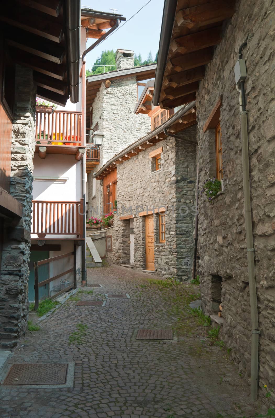 ancient stone homes and steet in La Thuile, Aosta Valley, Italy