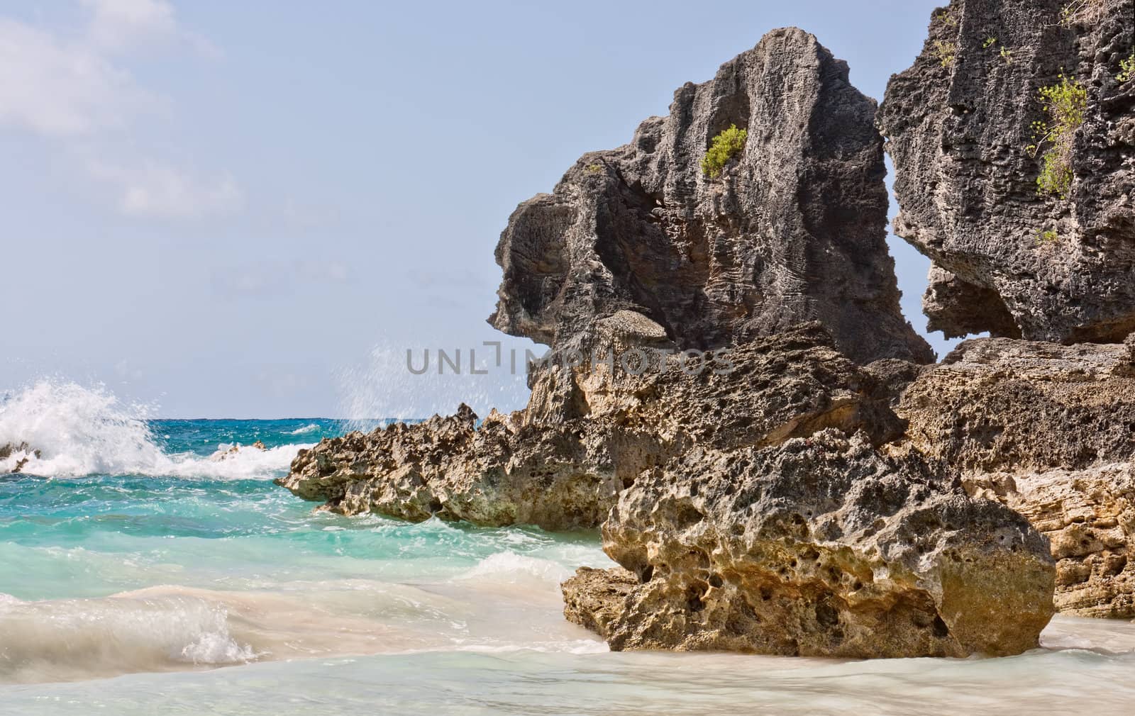 Large rocks, or boulders, in the atlantic ocean in the coastal waters of Bermuda. Photo was taken at Horseshoe Bay in Bermuda.