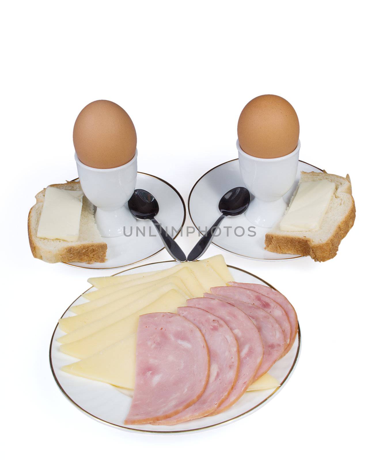 Eggs, cheese and sausage on a white background
