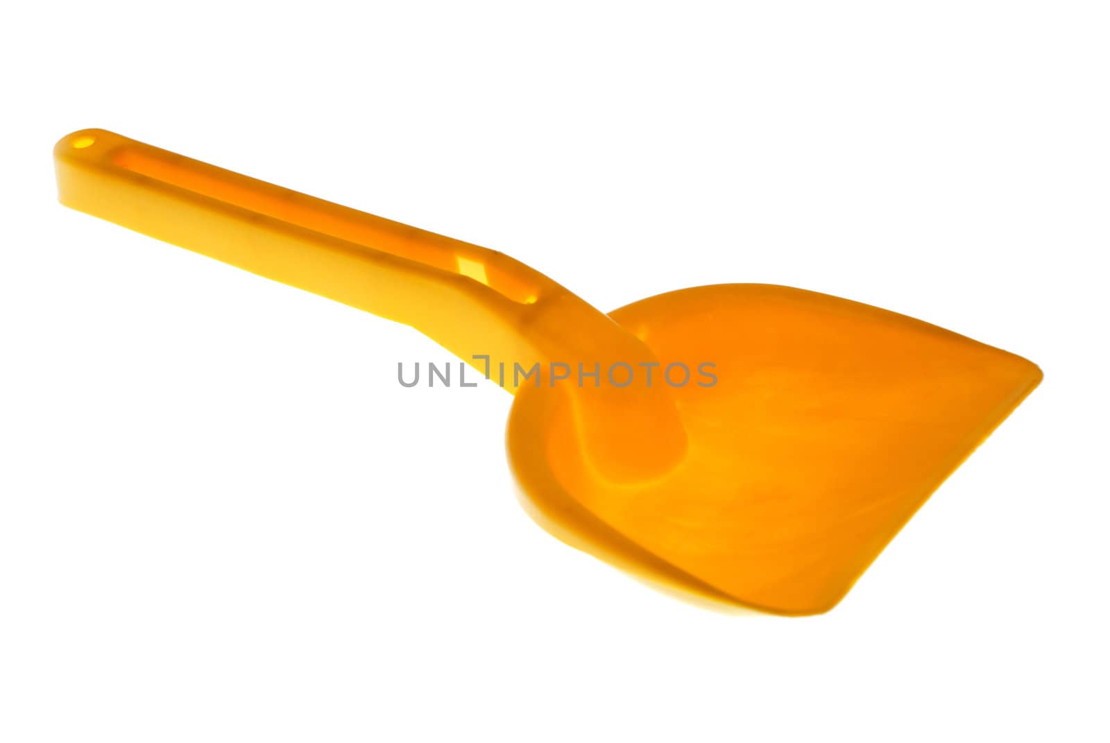 Orange toy shovel isolated on a white background.