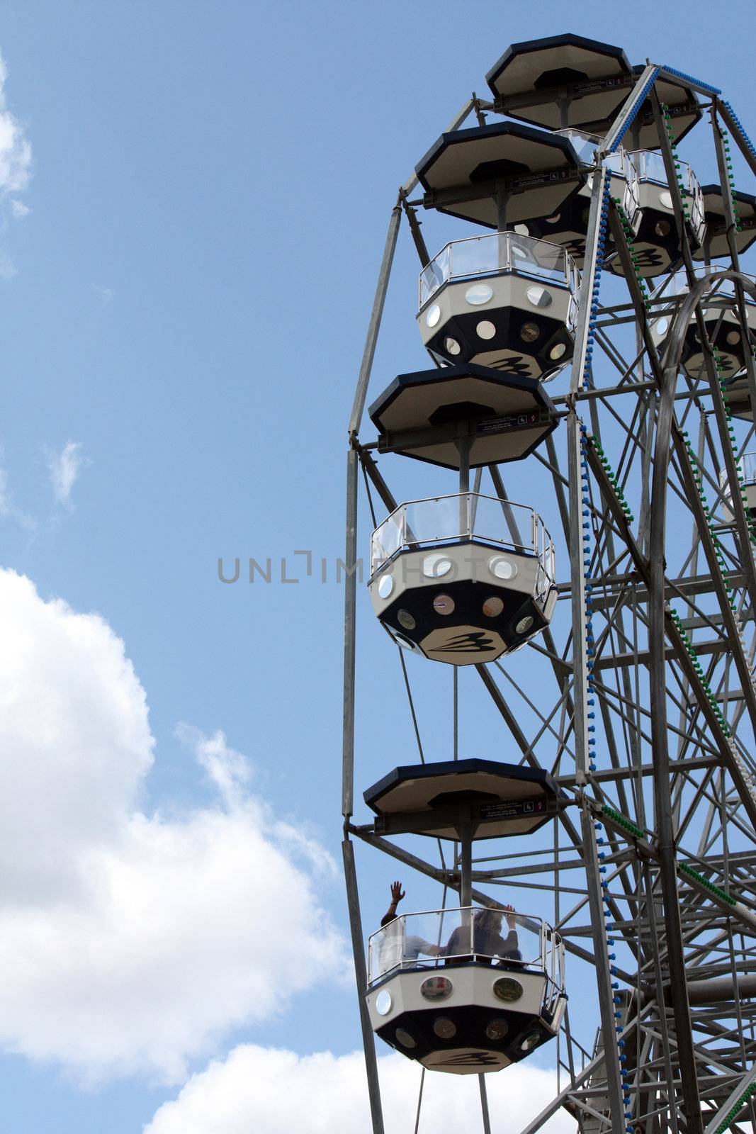 Partial view of a giant wheel on an amusement park.