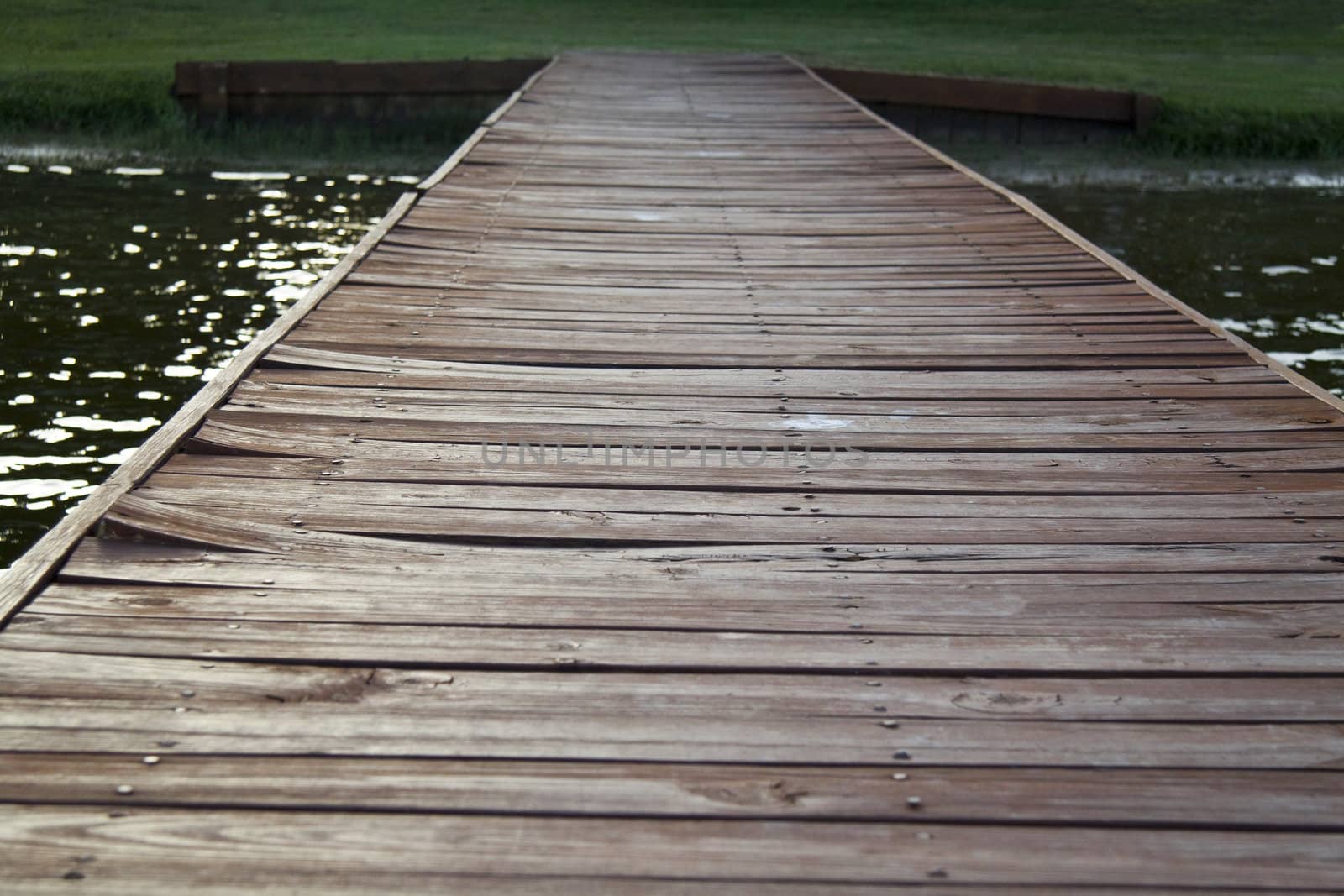 An old wooden dock heading off in the distance