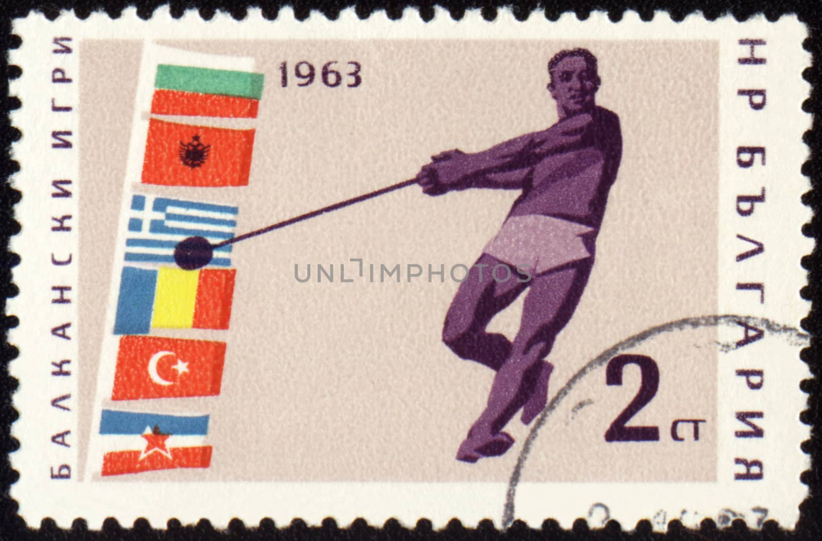 BULGARIA - CIRCA 1963: A post stamp printed in Bulgaria shows sportsman with hammer, devoted to Balkan games, series, circa 1963