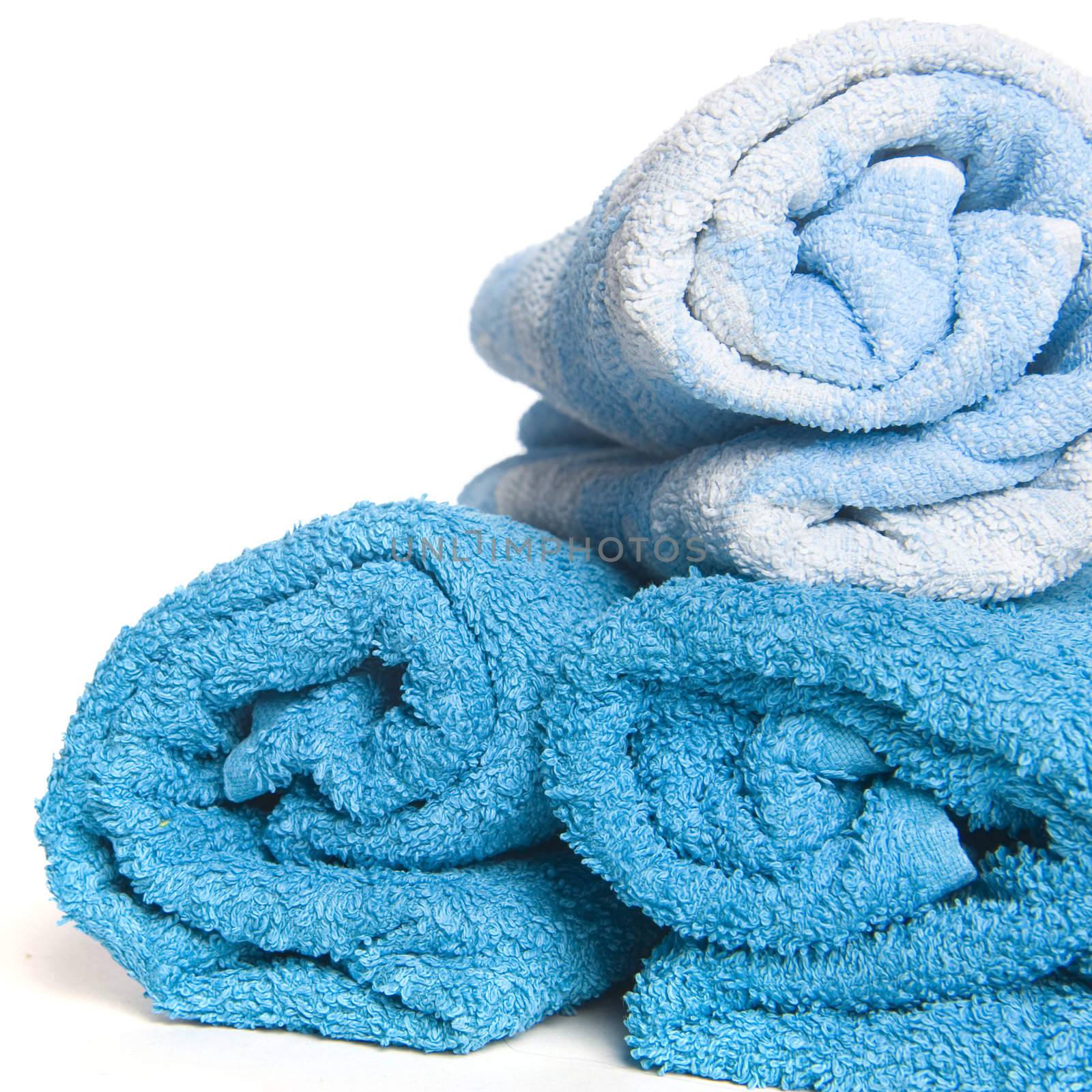 three blue towels on a white background