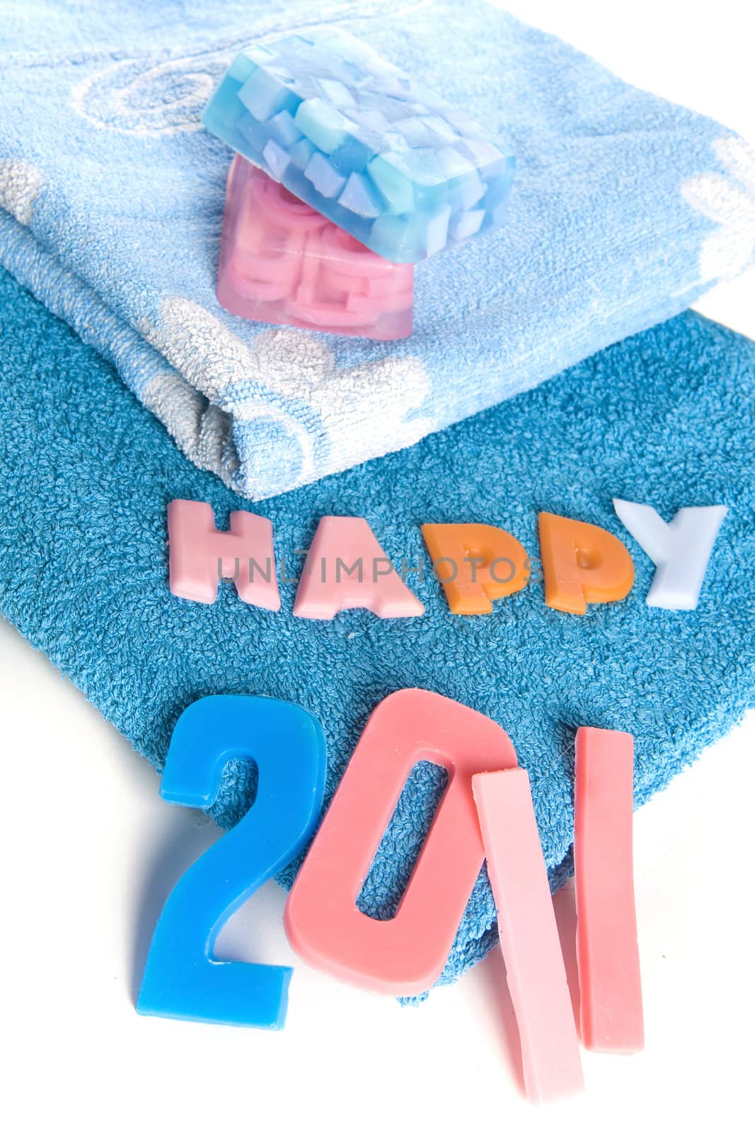 a blue towel and soapletters spelling "happy 2010"