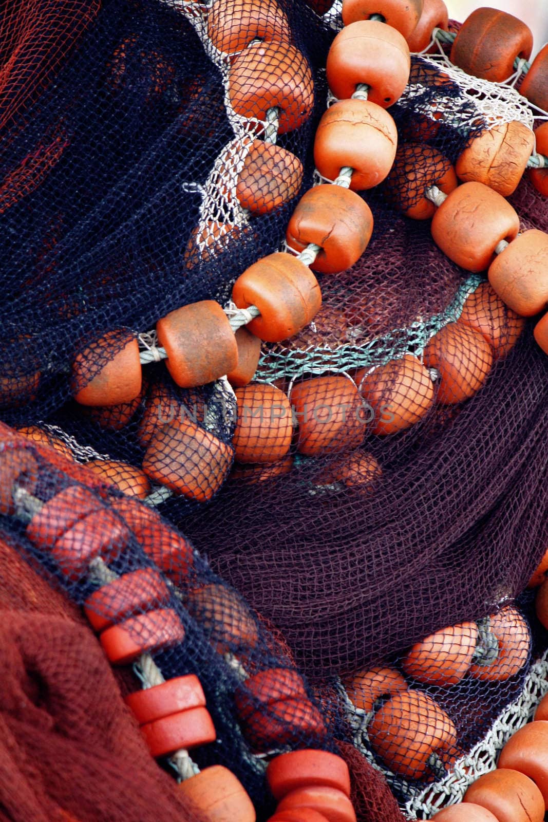 Pile of fishing net and floaters and rope.