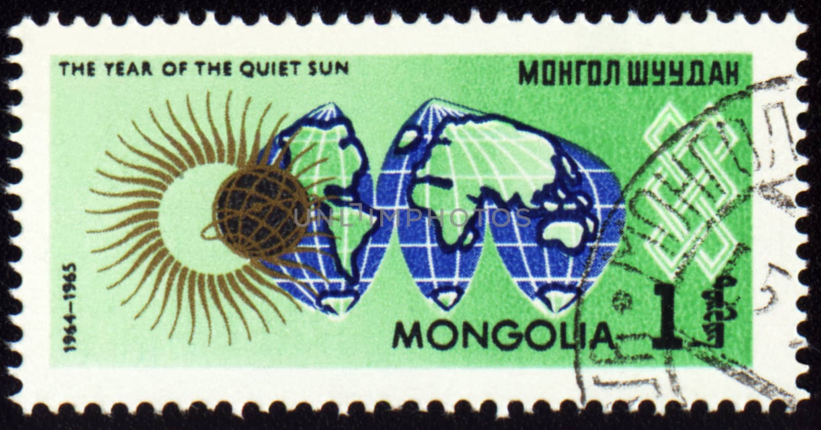 MONGOLIA - CIRCA 1965: stamp printed in Mongolia, shows map Globe and symbol of the Sun, series "The year of quiet Sun", circa 1965