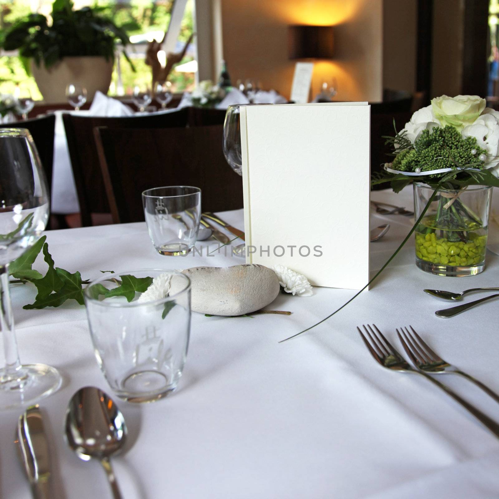 menu card on an elegantly set table in the restaurant