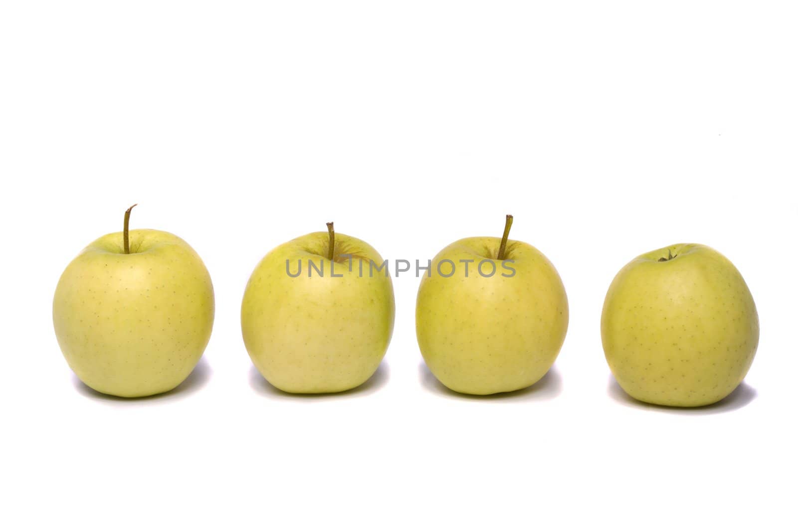 Close view of a bunch of yellow ginger gold variety type apples isolated on a white background.