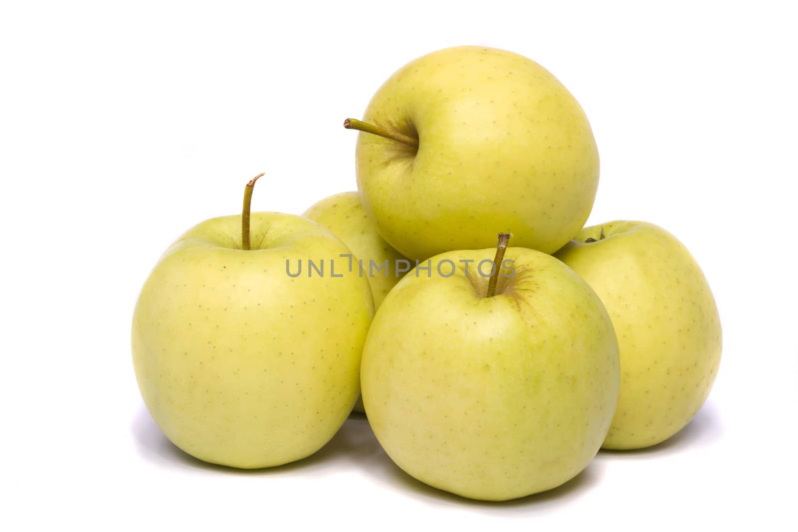 Close view of a bunch of yellow ginger gold variety type apples isolated on a white background.