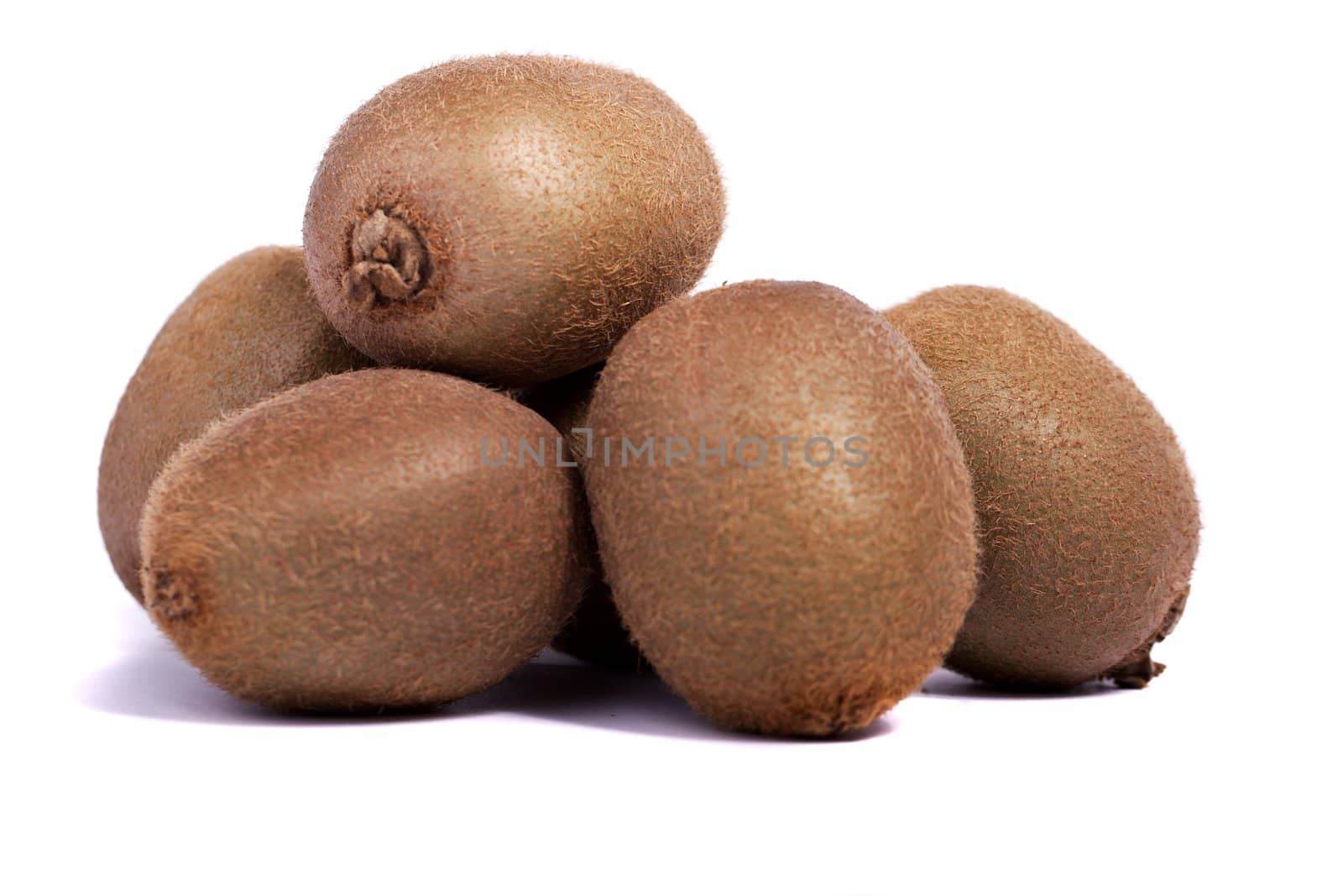close view of a bunch of kiwi fruit isolated on a white background.