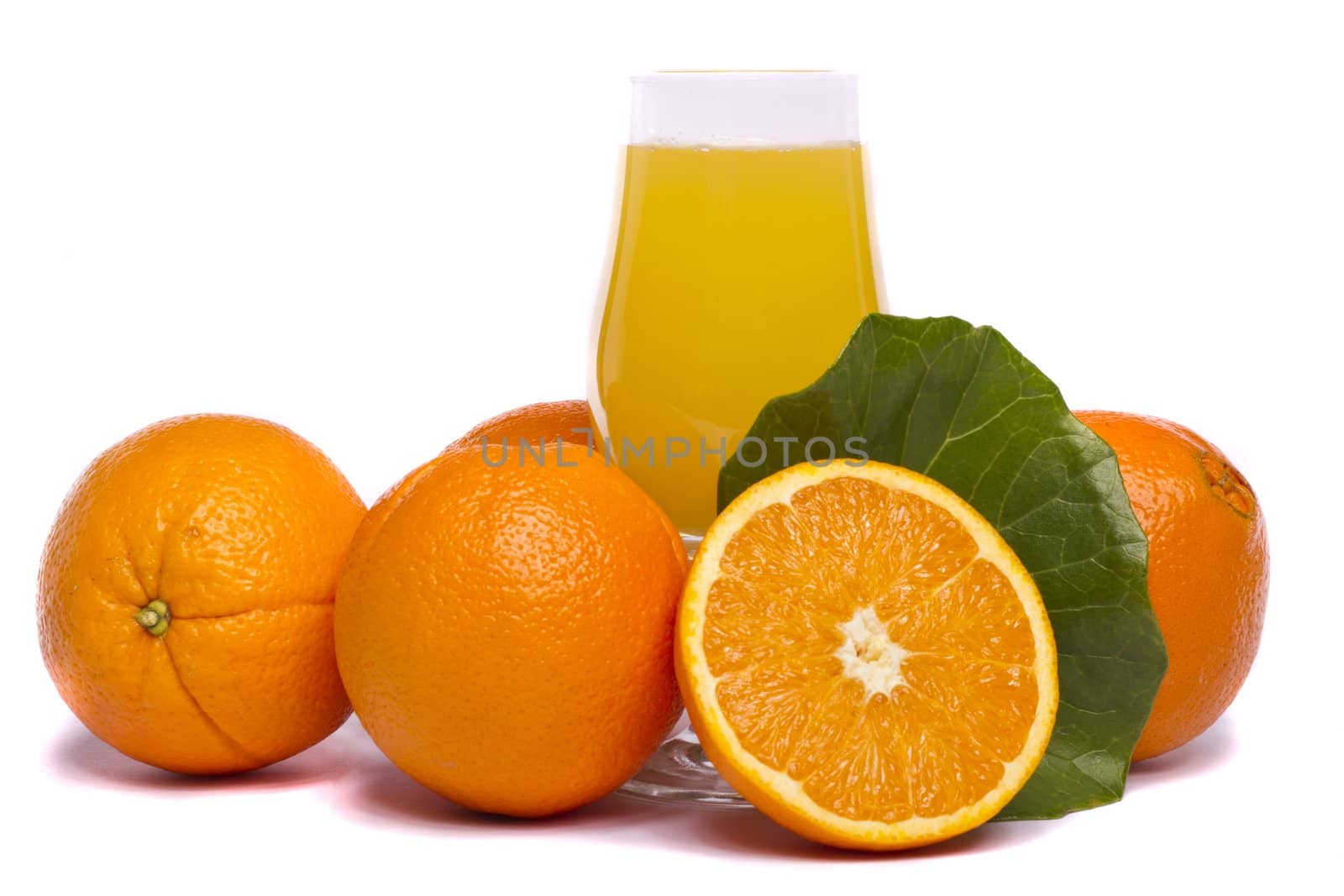 Close view of a bunch of oranges with glass of juice, isolated on a white background