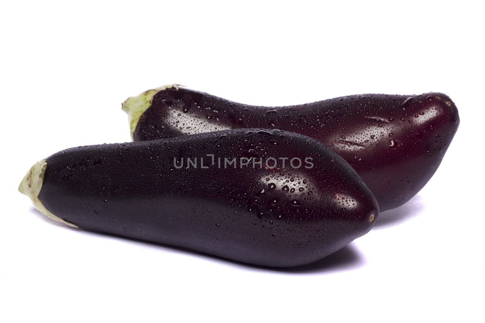 Close up view of an eggplant vegetable isolated on a white background.