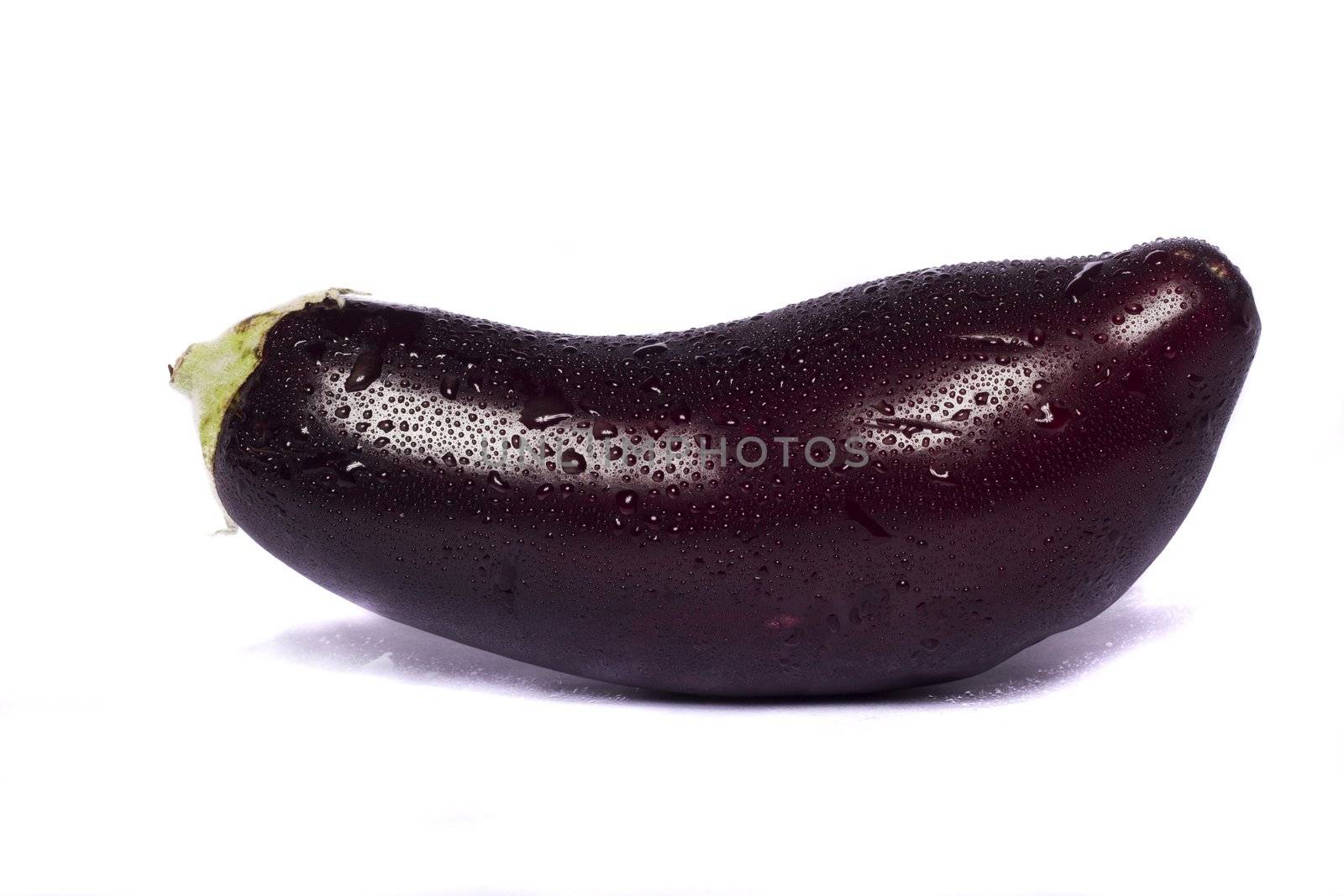 Close up view of an eggplant vegetable isolated on a white background.