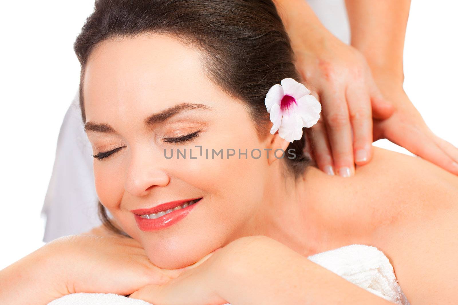 Closeup of a beautiful young woman  enjoying a massage.
