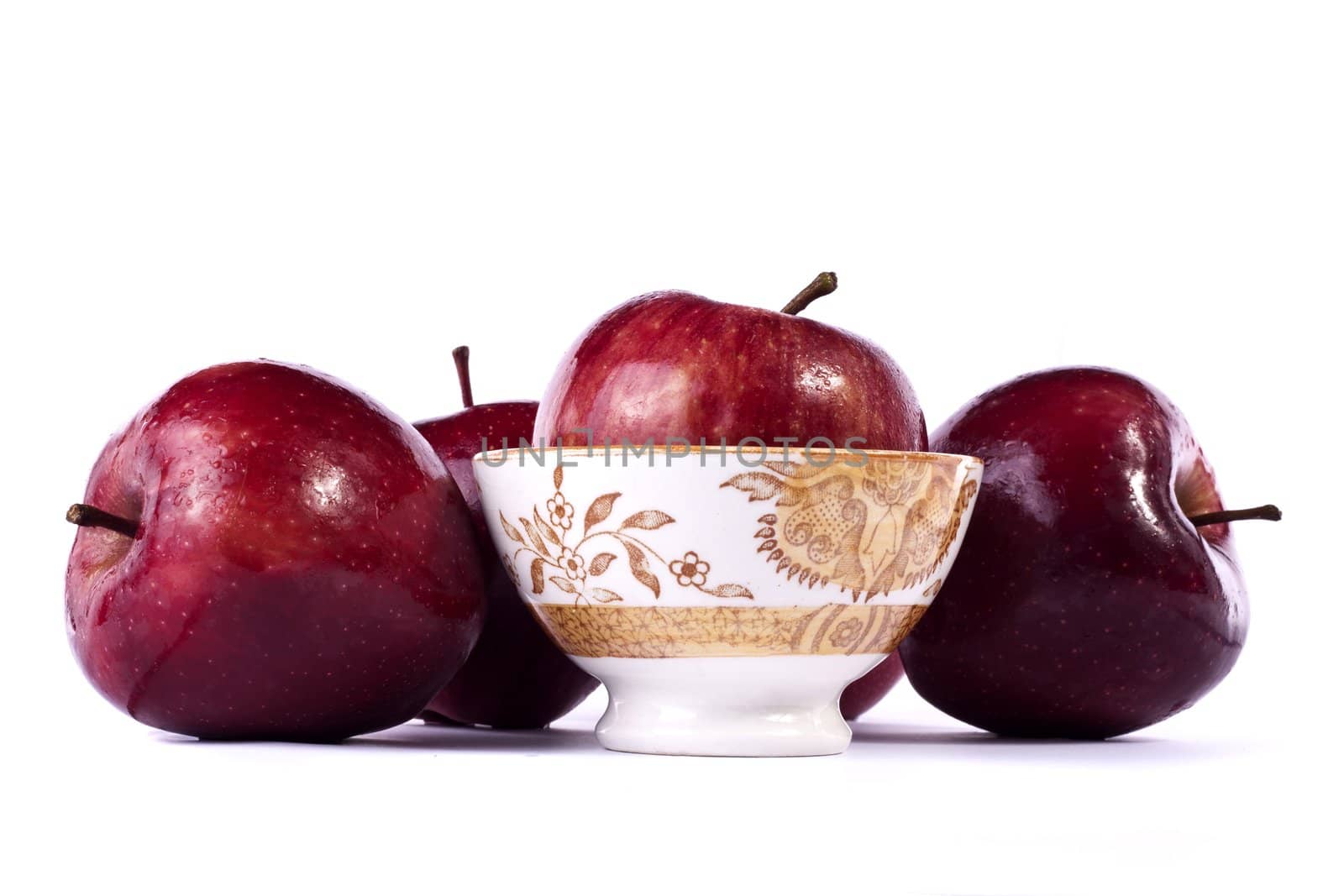 Close up view of some red apples isolated on a white background.