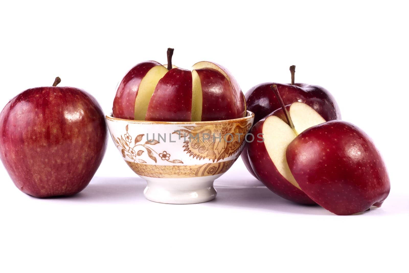 Close up view of some red apples isolated on a white background.