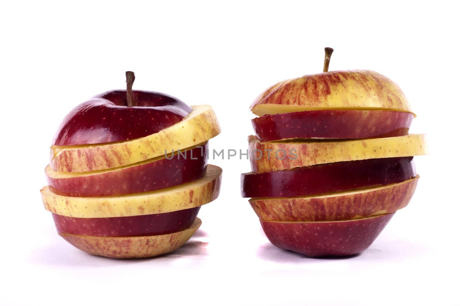 Close up view of some red apples isolated on a white background.