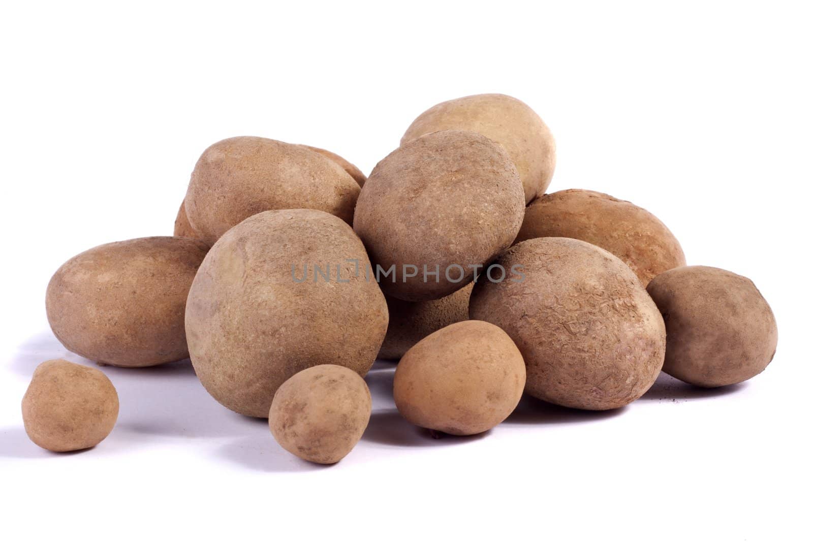 Close up view of some potatoes isolated on a white background.